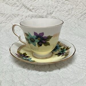 Queen Anne bone china vintage tea cup and saucer, blue daisy with yellow, purple